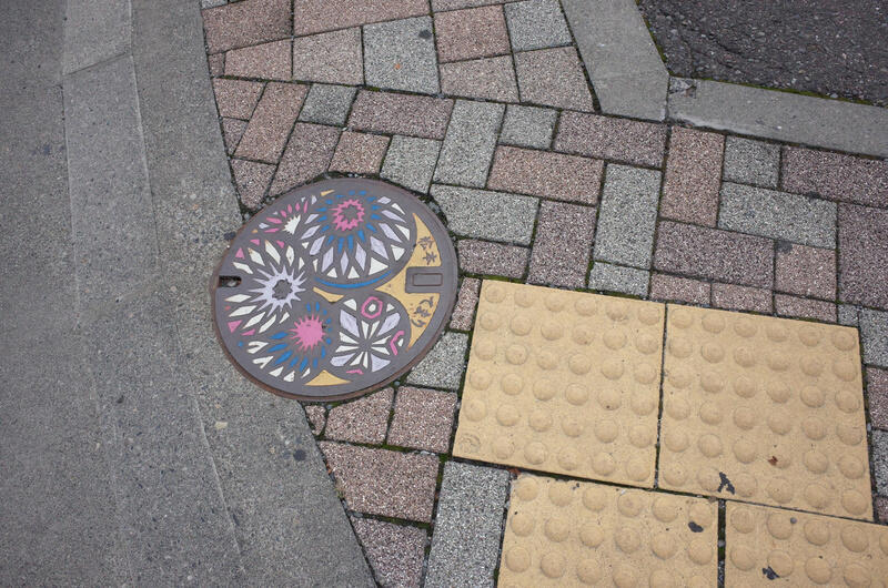 A brightly colored manhole cover