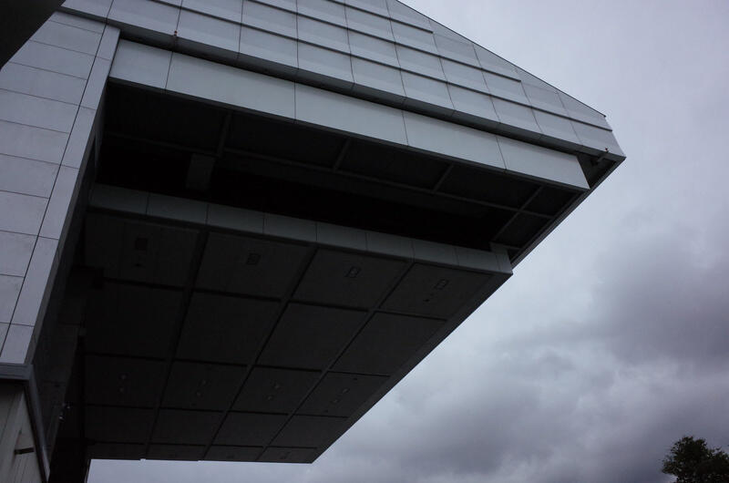 Part of a building against an overcast sky