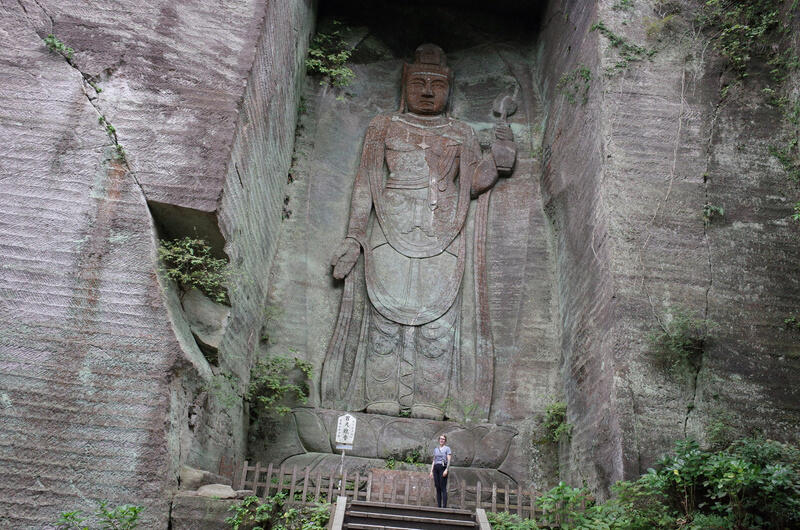 A large Buddha carving on a mountain side at Kenkonzan Nihon-ji Temple