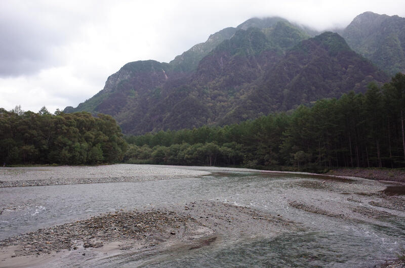A river with mountains in the background
