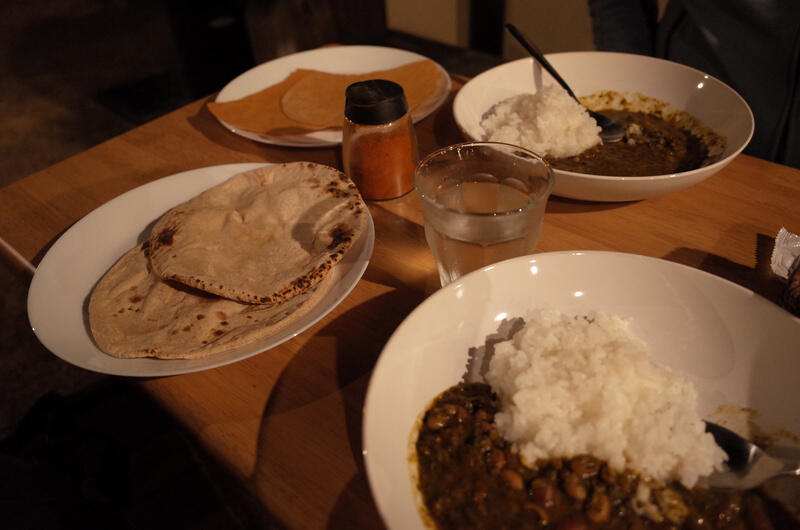A table with two plates of curry