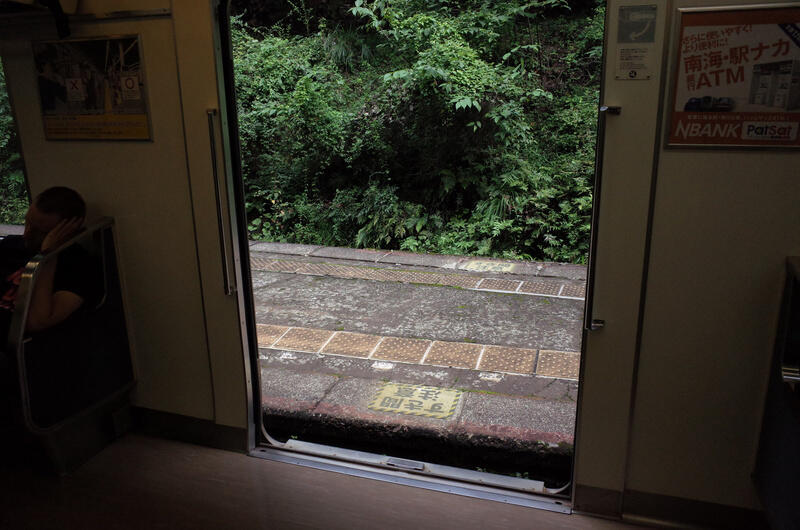 A view of open train doors and train platform